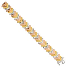 A Three-Color Gold and Diamond Bracelet. 8