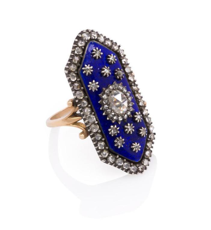 A Georgian rose diamond and blue enamel ring of elongated hexagonal design with scrolled shoulders, in 15k.