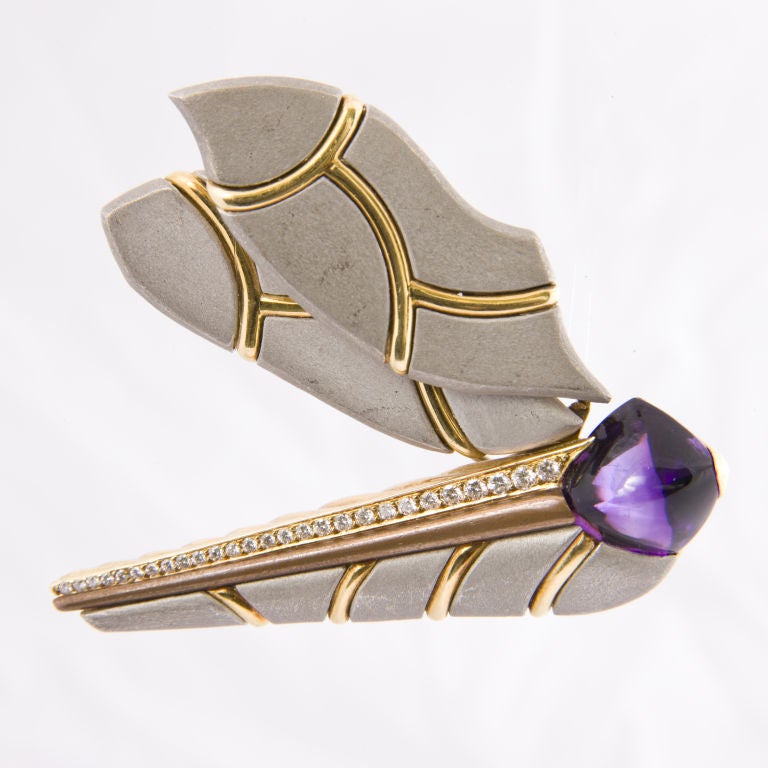 Handmade in a matt finish platinum with 18kt. yellow gold accents, this brooch is channel set along the body with approx. .50cts. of round brilliant cut diamonds, the head is set with a natural amethyst, it measures an impressive 2 1/2