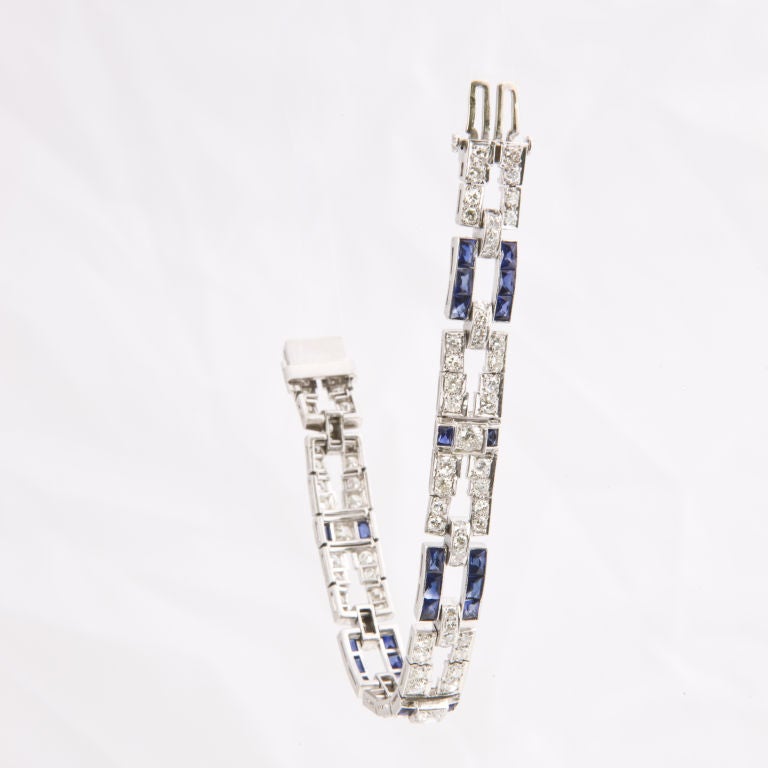 Finely made Art Deco bracelet, bead set with 80 round brilliant cut diamond links, and 16 round single cut diamond connecting links, total diamond weight approx. 8.0 cts, the sapphire links are channel set with 18 french cut synthetic sapphires and