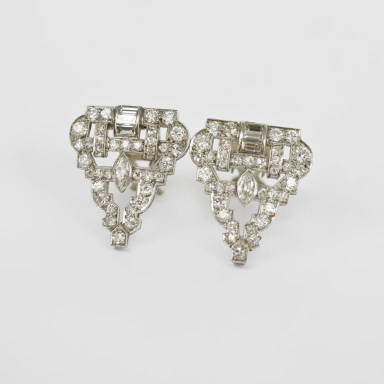 Dress up, or dress down, this pair of handmade diamond clips,may be worn with or without the custom made 14kt. yellow gold retro modern frames, each of the platinum clips are bead and channel set with 36 round european and mine cut diamonds, 3