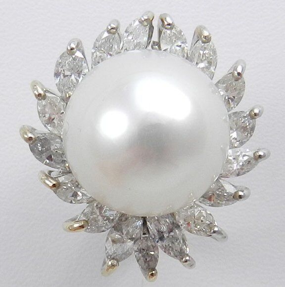 Handmade 18kt. white gold South Sea pearl earrings, each of matching AAA pearls measure approx. 15.5 mm., surrounded by 17 marquise cut diamonds weighing a total of approx. 5.5 cts., grading VS1-Vs2 clarity E-G color, clip and post back