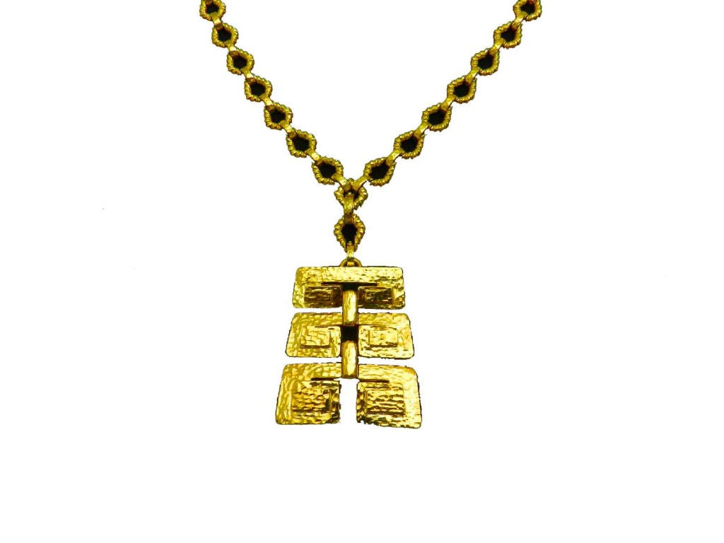 18kt. yellow gold hand hammered Webb necklace with removable pin pendant. The Mesoamerican design pendant is articulated in a graduated form and measures 2 1/2