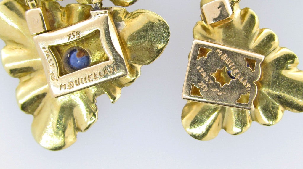 Distinguished understaded suite of softly finished 18kt.yellow gold. Consisting of bracelet, necklace and clip back earrings. Each of the trefoil links are bezel set with a cabachon natural blue sapphire. Each piece is  signed M. Buccellatti