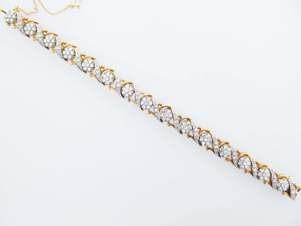 Very fine quality and workmanship and extremely well priced 18kt yellow gold Jabel diamond bracelet. Prong and bead set in white gold with 150 round cut diamonds totaling approx. 3.25cts. Each link is individually signed on the back.