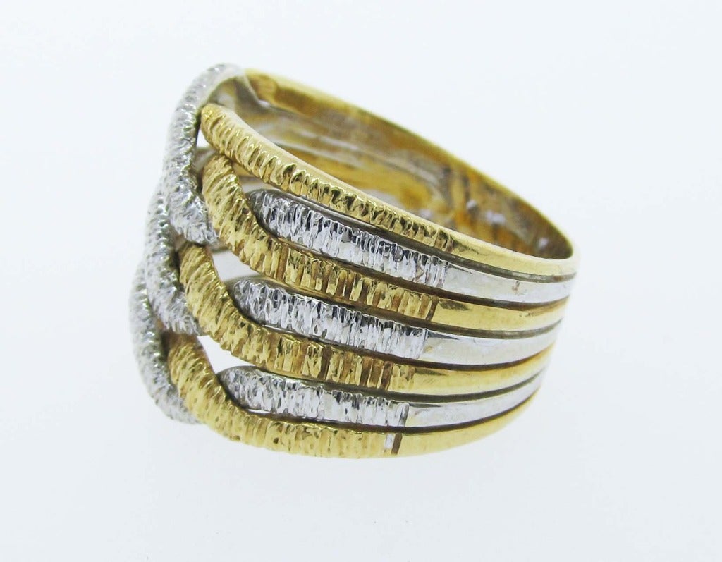 18kt. yellow and white woven  textured wedding band size 8 1/2 and may be sized.