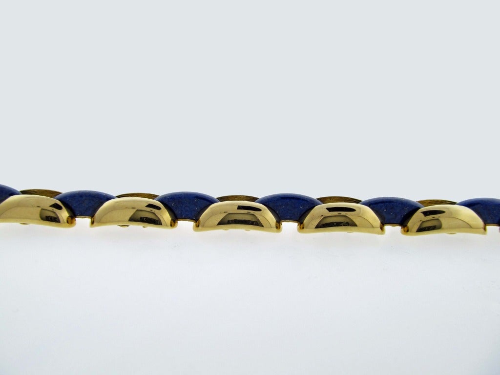 18kt.heavy yellow gold  domed link bracelet with 6  natural lapis connector links. The bracelet  is as well made on the back as it is on the front measuring  7
