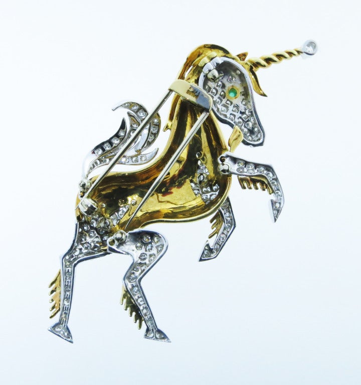 Excellently constructed and wonderfully detailed, the unicorn's head, neck, and tail are bead set in 18kt white gold with 138 round brilliant cut diamonds totaling approx.3.3cts. Grading VS clarity G color. The body of the unicorn is enameled in