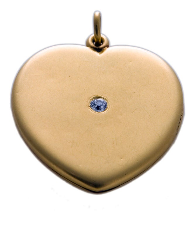 Gold heart locket with diamond.