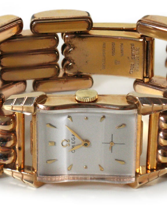 An 1940s adjustable ladies reticulated custom made Omega bracelet watch in 18 kt rolled gold
