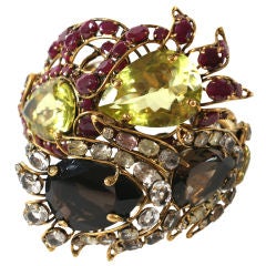 Glamorous hinged cuff of semi-precious stones