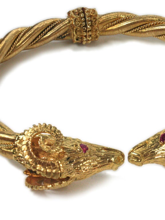 Lalounis vintage hinged twisted rope designed 18 kt gold rams head signed bracelet with ruby eyes