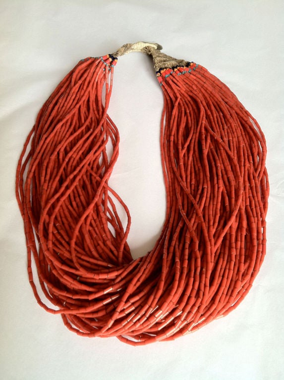 Fine vintage ethnic coral bead necklace. Authentic & outstanding multi-strand (80 strands) item with woven beaded ends/loop & button closure.