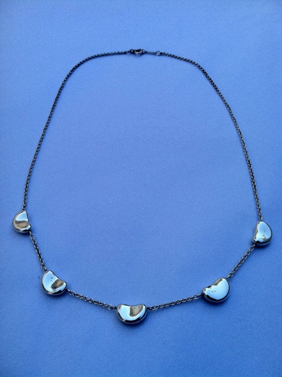 Fine vintage Tiffany & Co. 5 'bean' necklace. Authentic signed sterling silver item (model not currently in production).