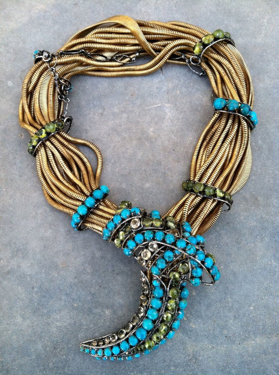 Fine Iradj Moini 'serpent' necklace. Authentic signed item with turquoise & peridot cabochon stones. Gilt snake chains with silver tone metal details. Item features hidden front hook clasp. Outstanding design & execution.