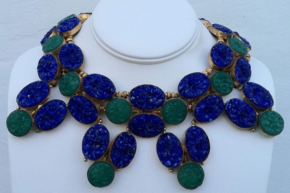Fine vintage William de Lillo collar necklace. Exquisite gilt metal bezel set linked item features both carved 'Lapis' and Jade' centers. Original hidden push clasp intact.

Rare item from the William de Lillo archives

William de Lillo