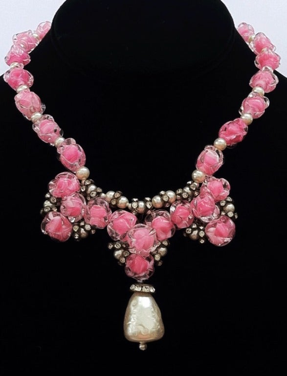 Fine vintage Louis Rousselet necklace. Exquisite hand wired vivid pink/clear art glass beads with faux pearls, crystal rondelles and a large drop. Signature hidden push clasp intact. Unsigned.

*Please contact dealer to purchase with free FedEx