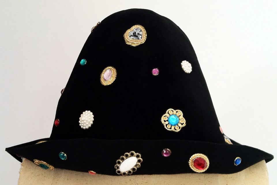 A rare vintage Christian Lacroix Haute Couture 'jeweled' hat. A large/oversize jet black fur felt 'bucket' item features applied 'jewels'. One size fits all item.