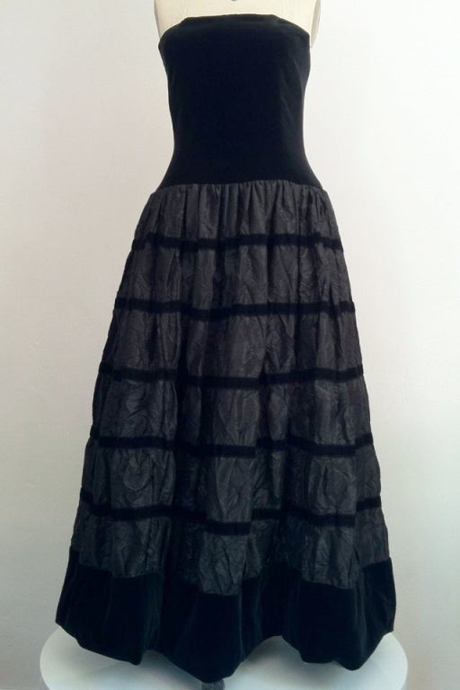 A fine vintage Chanel ball gown. A rare item features a full 'crinkle' jet silk taffeta skirt banded in black velvet. Matching black velvet boned bodice features a separate additional inner bodice, both zip up back.