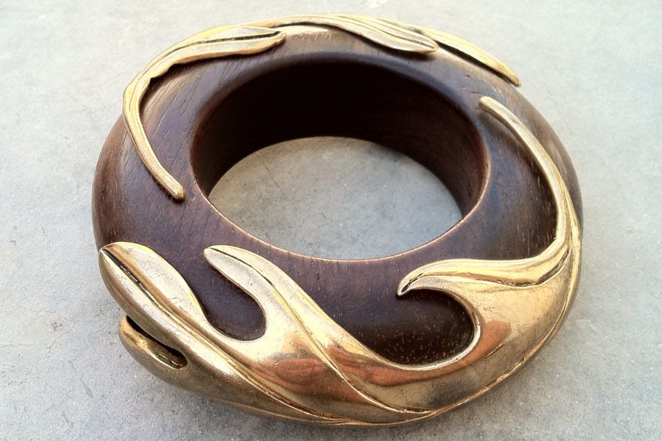 A fine and rare vintage Isabel Canovas wood and bronze bangle bracelet. Heavy signed thick wood bangle features gilt bronze mounts.