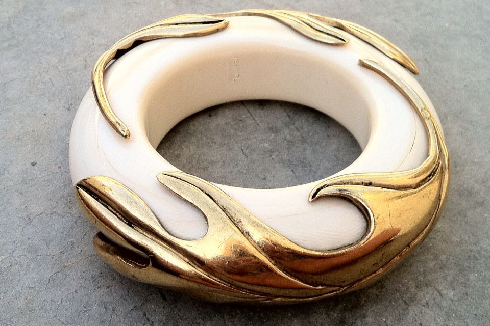 A fine and rare vintage Isabel Canovas ivory and bronze bangle bracelet. Heavy signed thick ivory bangle features gilt bronze mounts.