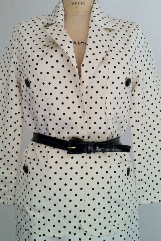 A fine vintage Celine dotted cocktail dress. White and black heavy woven silk faille fabric items fully silk lined. Jacket features a single button front closure with matching button trim. Matching pencil skirt zips up back. Skinny belt not included.