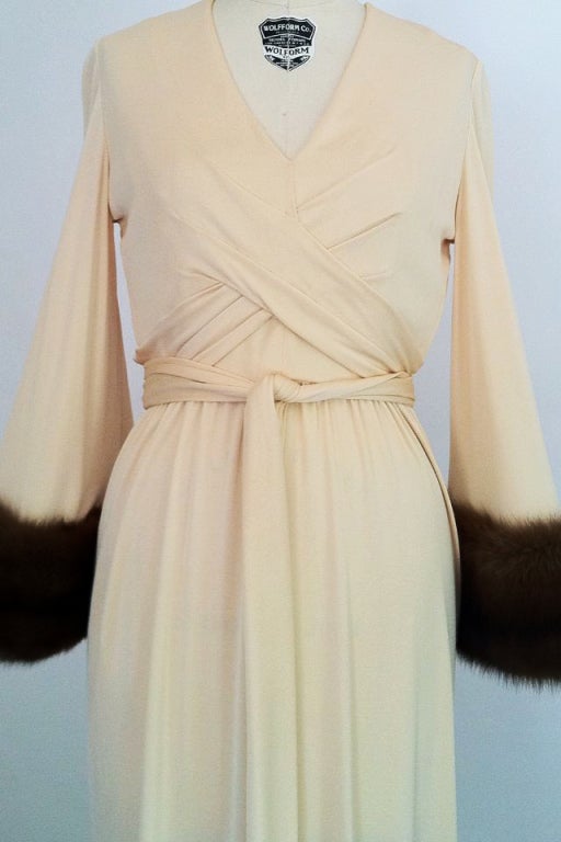 A fine and rare vintage Bill Blass jersey gown with sable fur cuffs. Exquisite cream silk jersey item features a ruched 