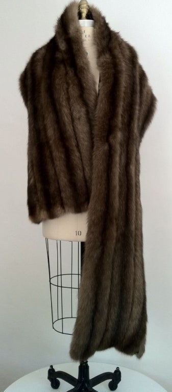 A fine and luxurious vintage Russian sable fur wrap. Stunning four row fur item abundant with long silver hairs. Item fully silk lined and properly cold-stored. Pristine.