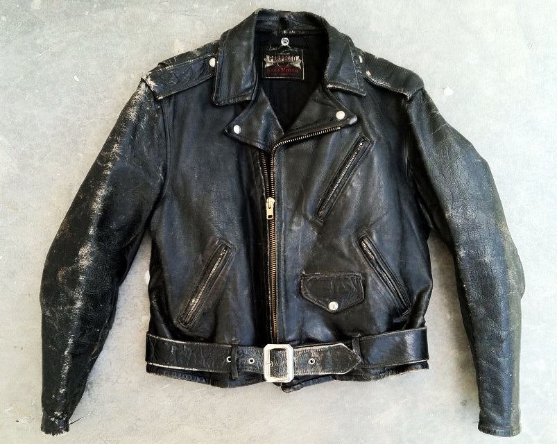 A fine and iconic vintage Perfecto leather motorcycle jacket. The original version that inspired many including Marlon Brando in the Wild Ones film. Item beautifully worn with original patina, original zippers, snaps and early version belt buckle.
