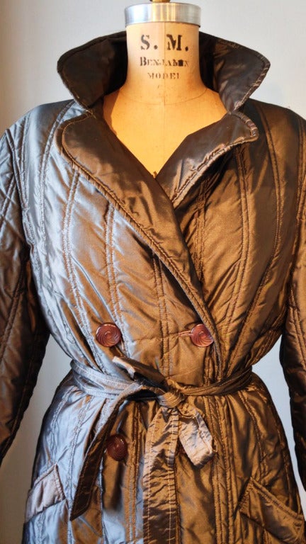 A fine vintage Diane Von Furstenberg 'sleeping bag' belted coat. Pewter quilted fabric item fully lined with a wrap front and matching belt.