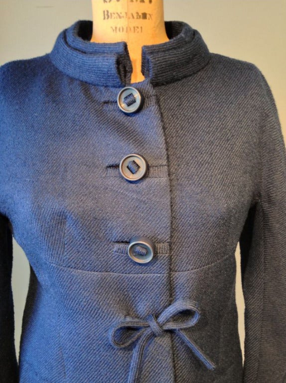 A fine and rare vintage Pierre Balmain Haute Couture jacket. Blue wool fabric item features precision seams, tie and button front closures. Boxy jacket fully silk lined.