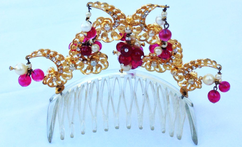A fine and rare vintage Maison Gripoix diadem/tiara. Exquisite gilt filigree 'crown' mounted with crystals and red pate de verre glass beads with faux pearls. Diadem mounted on a French clear plastic hair comb. Item appropriate for any collection or