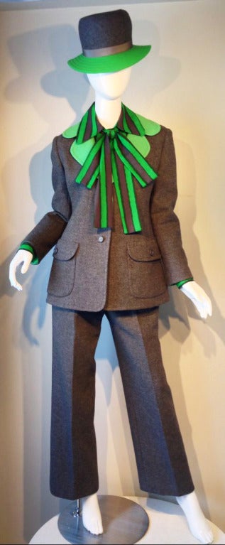 A fine and rare Christian Dior couture ensemble, 1972. Total look consists of: Grey wool  flannel jacket, matching trousers, skirt (not shown) plus blouse, bow tie, leather belt. Matching hat constructed by Ms. Alice of Saks Fifth Avenue of matching