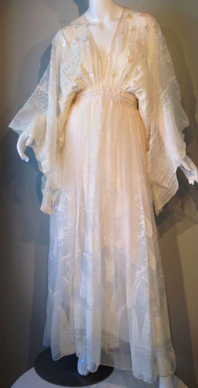 A fine and rare vintage Zandra Rhodes ethereal gown. Stunning ivory silk fabric item features white 