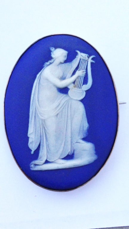 A fine and rare 19th century Wedgwood brooch. Blue and white jasper ware item with original metal mount and pin back.