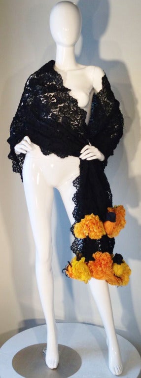 A fine and rare vintage Isabel Canovas lace shawl/wrap. Fine black d'Alencon lace trimmed with luscious hand constructed flowers from Lemarie Paris. Item can be worn any number of ways..