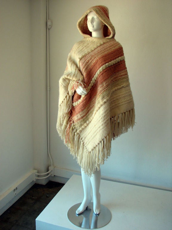 Fine & rare vintage Martine Gruber 'art to wear' hooded cape. Fine handwoven  wool item slips over head with fringed trim & hood.