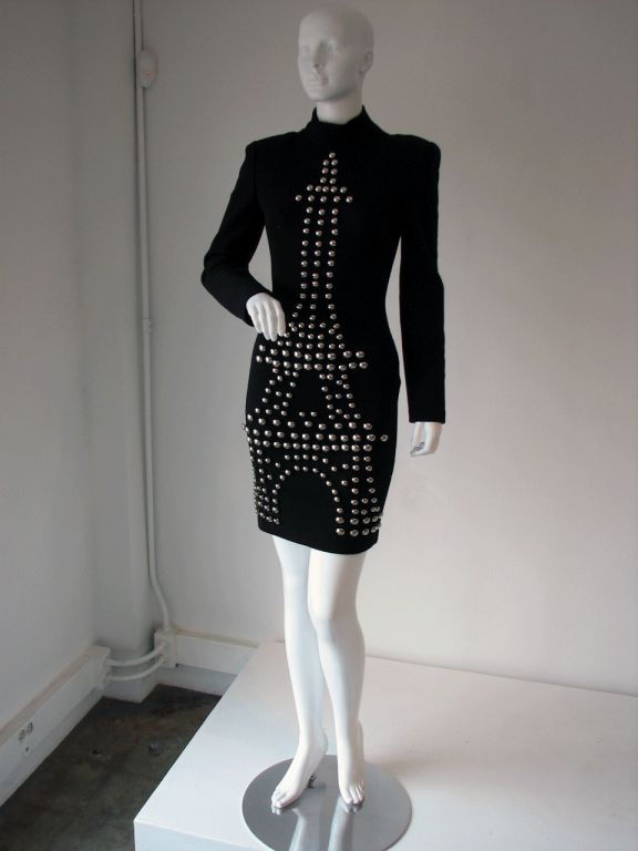 Fine & rare vintage Patrick Kelly 'Eiffel Tower' button dress. Black wool jersey item with silver tone buttons. Item zips up back with shoulder pads.