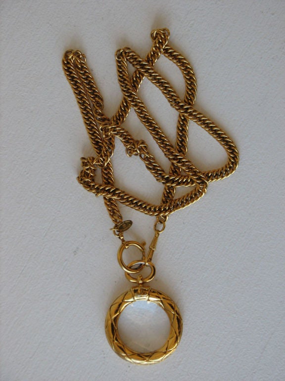 Fine & rare vintage Chanel lorgnette & chain. Authentic signed gilt metal chain & bezel set crystal.