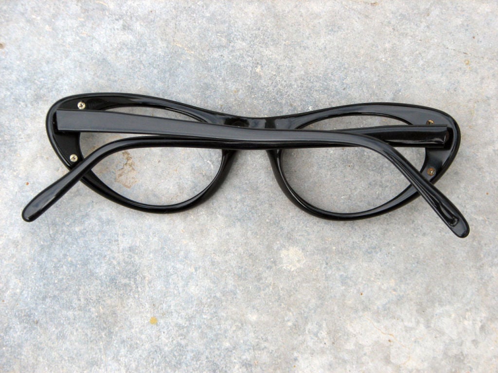 Fine & rare vintage Christian Dior 'cat eye' eyeglass frames. Never used black plastic frames with gilt & silver metal details.