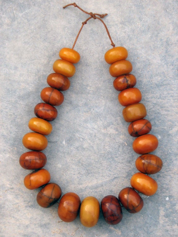 Fine vintage African trade beads necklace. Authentic Berber Tribe items on leather cord.