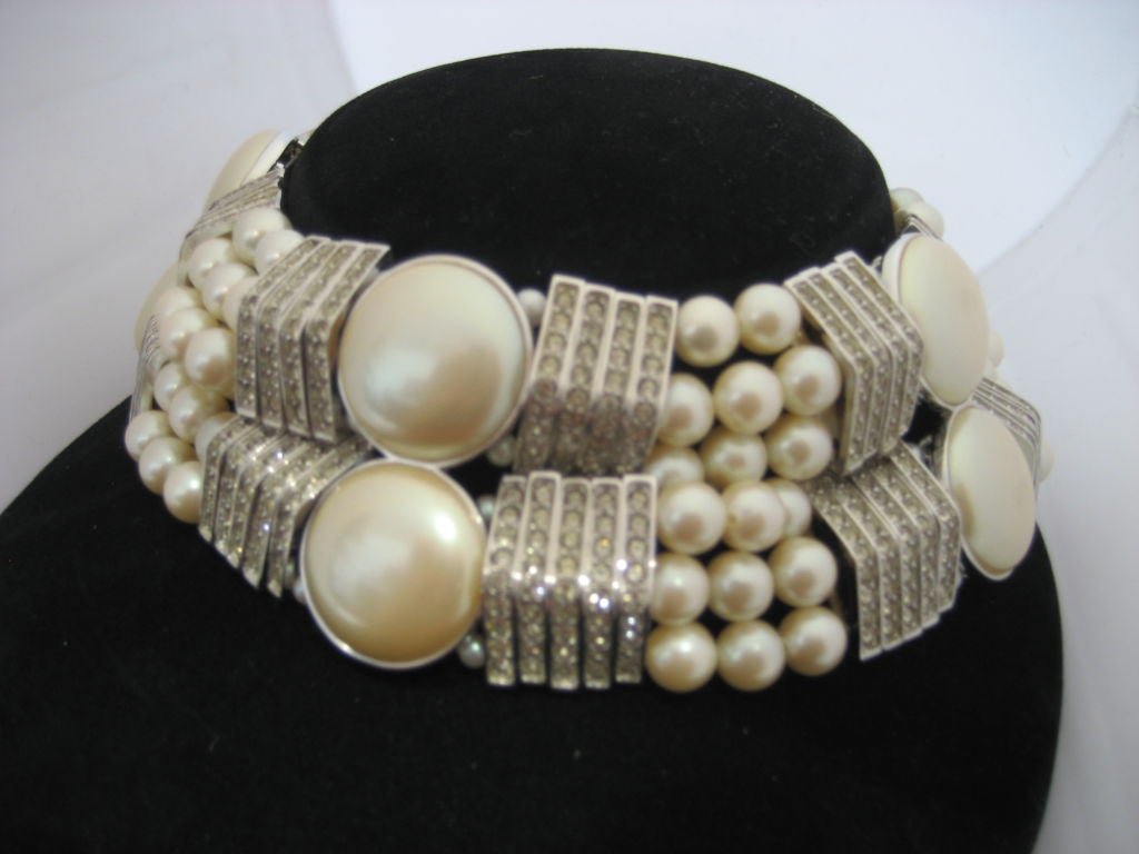 Signed and numbered YSL necklace 132 out of 500 produced. Pearl and rhinestone adjustable choker. Minimum length 14 inches- maximum length 20 inches long.