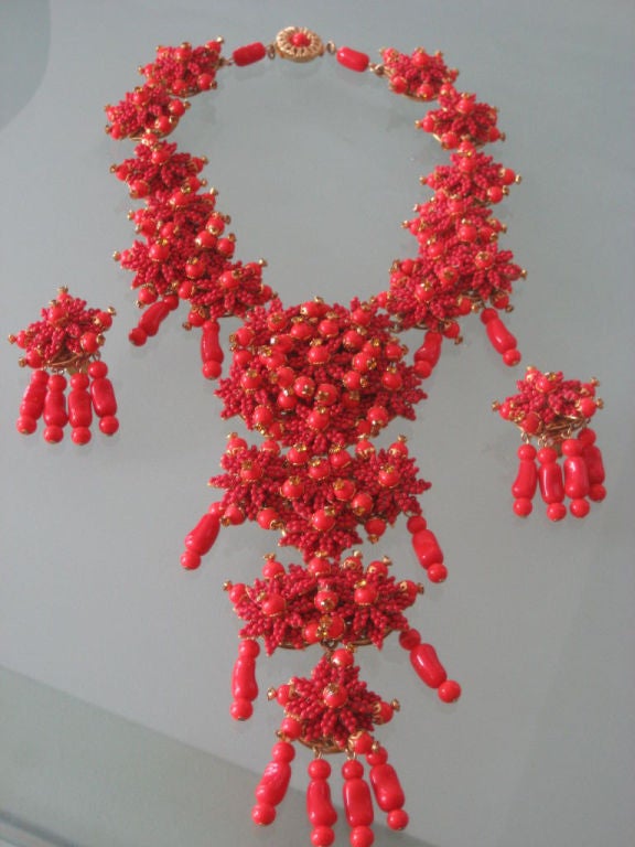 Statement necklace and earrings signed by Stanley Hagler NYC. This necklace comprises intricate beadwork forming floral multi tiered festoons.