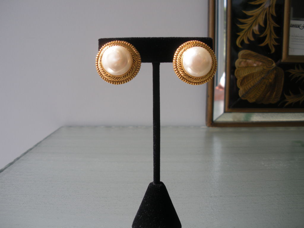 Pair of Chanel pearl clip on earrings with gilt rope edge.