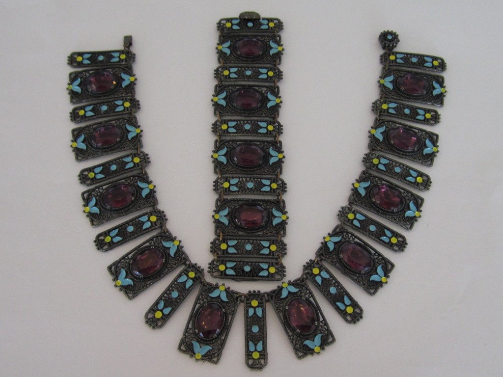 Art Deco necklace and bracelet suite- light blue enamel leaves with central purple glass faceted stones in filigree surround.