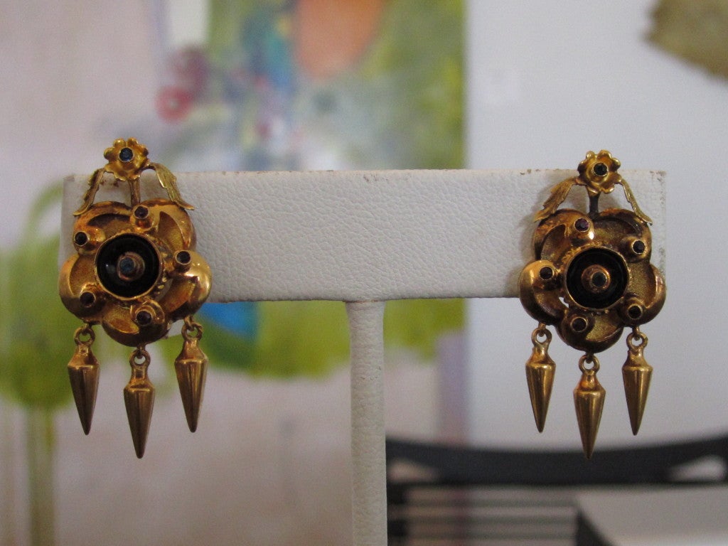 Pair of antique 19k gold lever back pierced earrings with small synthetic stones.