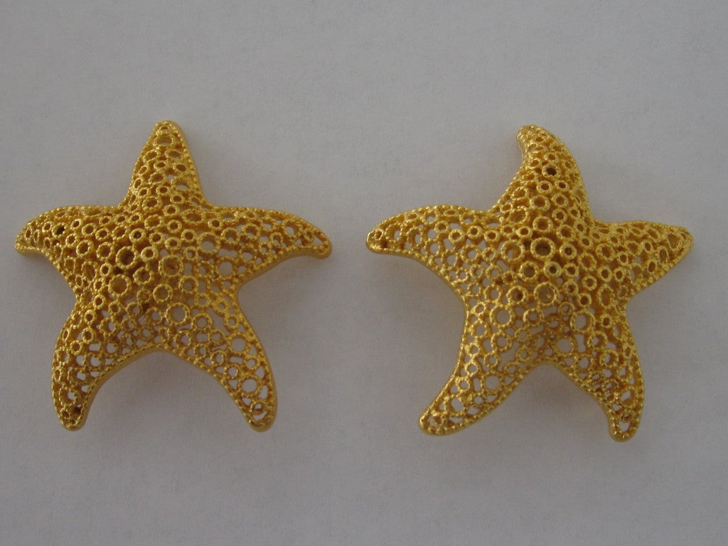 Pair of goldtone starfish clip earrings.