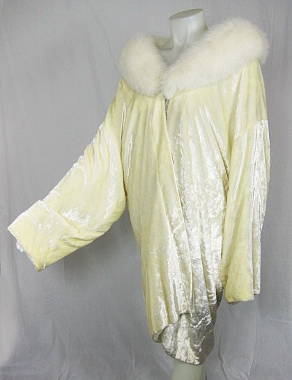 This is a beautiful silk Panne off white opera coat with white mink collar The color in pictures  looks yellow due to lighting ....it is a brighter white but does have a golden tone to it. It is lined and in excellent condition. Difficult piece to