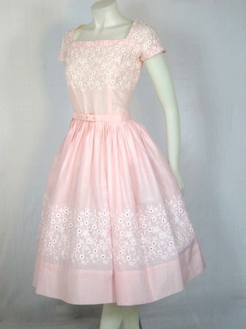 This is a very fine cotton pink dress with cap sleeves, full skirt. It has white floral embroidery and matching belt. Great resort wear dress! 
Bust:       38