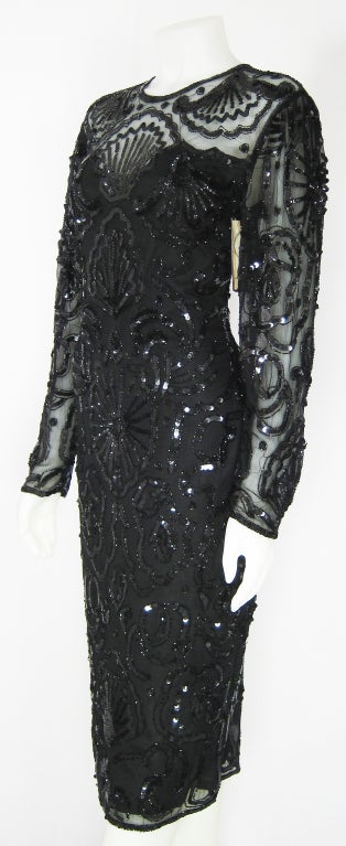Amazing Art Deco Styling Black Illusion sequin dress with long sleeves .

BUST: 36